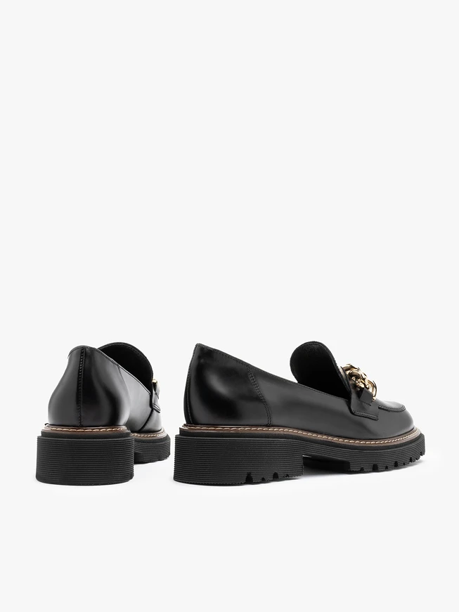 Black women’s loafers with chunky gold ornament