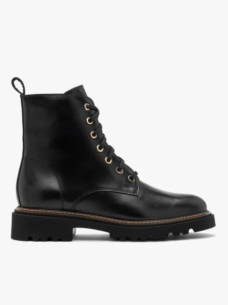 Black women’s boots with gold eyelets