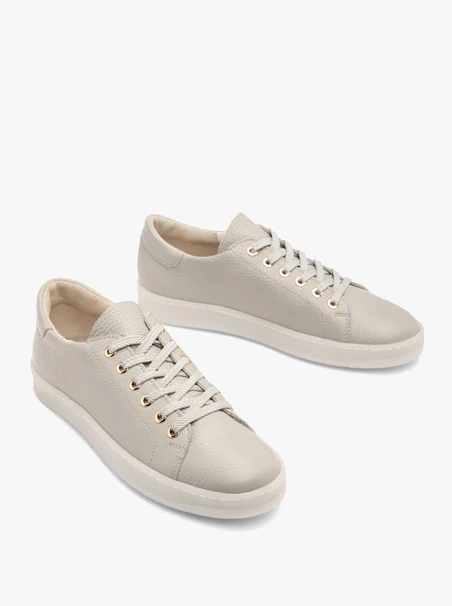 Gray sporty shoes on a flat sole