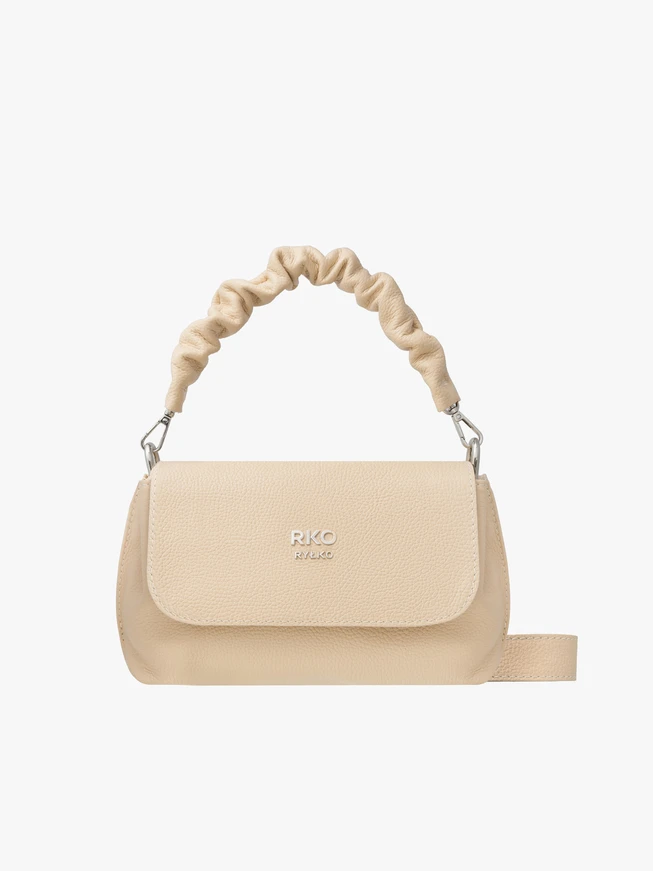 Small beige handbag with decorative handle