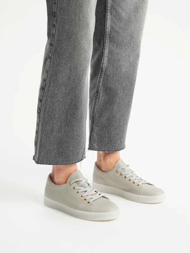 Gray sporty shoes on a flat sole