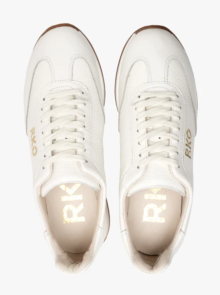 White sporty shoes with decorative embroidery