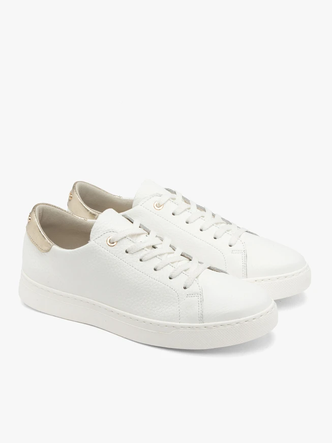 White sporty shoes with a platinum heel tab