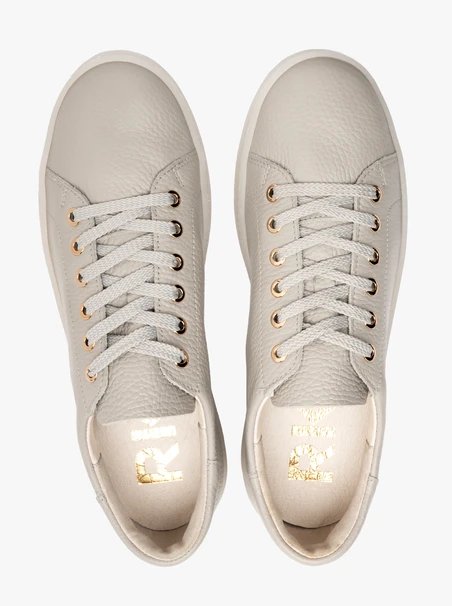 Gray sporty shoes on a flat sole