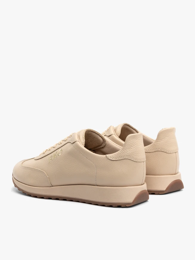 Beige sporty shoes with decorative embroidery