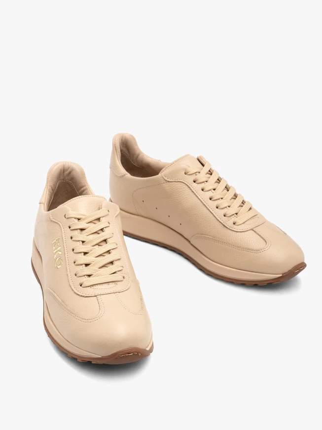 Beige sporty shoes with decorative embroidery