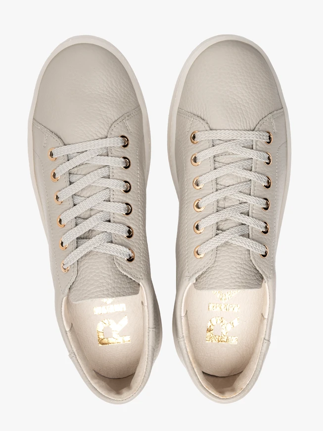 Gray sporty shoes on a flat sole