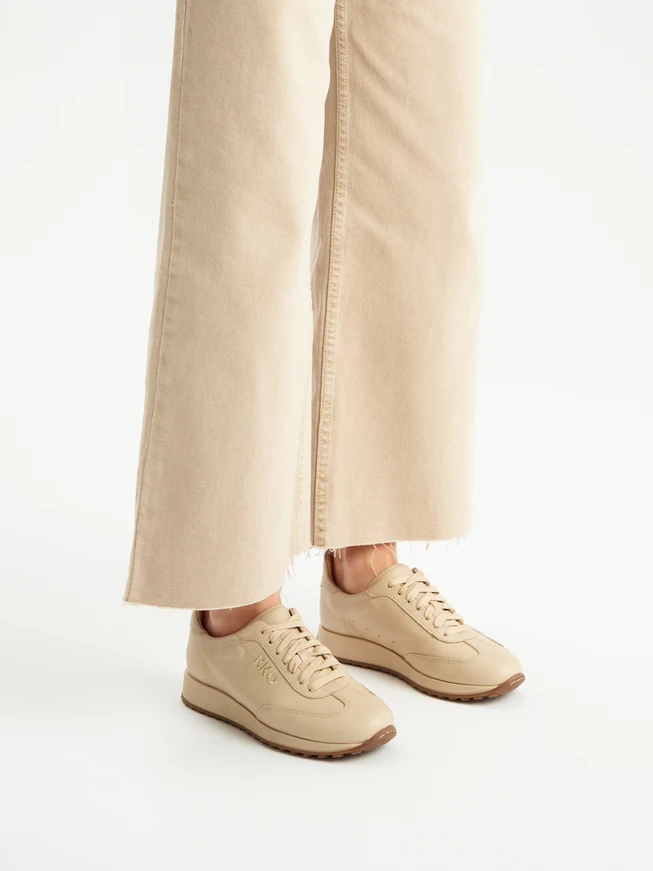 Beige sporty shoes with decorative embroidery
