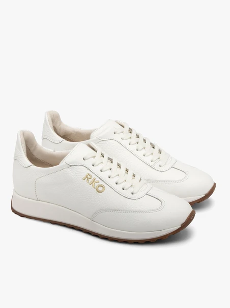 White sporty shoes with decorative embroidery