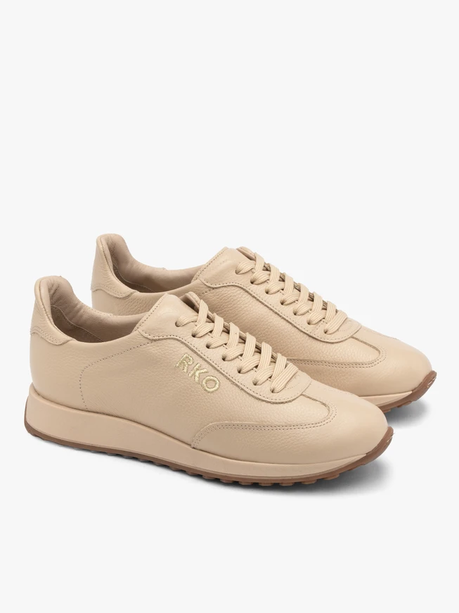 Beige sporty shoes with decorative embroidery