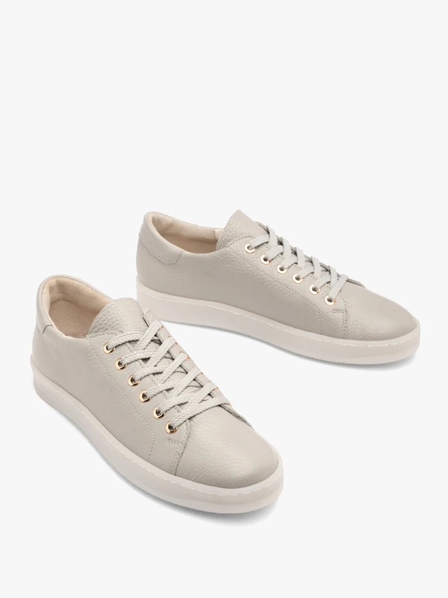 Gray sporty shoes on a flat sole