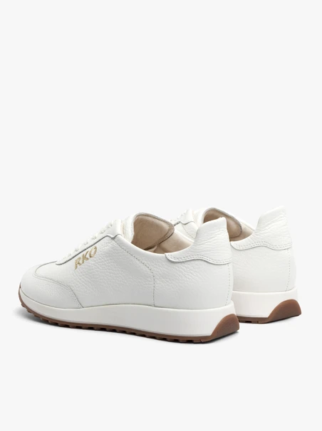 White sporty shoes with decorative embroidery