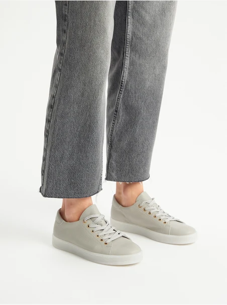 Gray sporty shoes on a flat sole