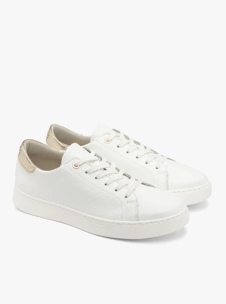 White sporty shoes with a platinum heel tab