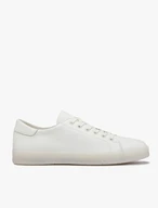 White sporty shoes on a flat sole
