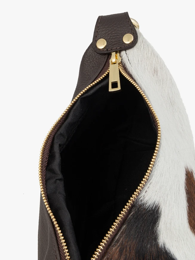 Medium-sized crossbody bag with cow print