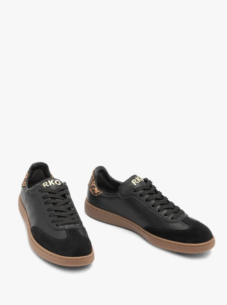 Schwarze Turnschuhe aus gebondetem Leder