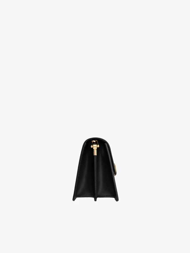 Schwarze elegante Handtasche für Frauen mit goldener Schnalle