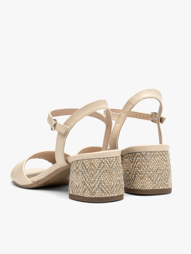 Beige sandals with decoratively covered heel