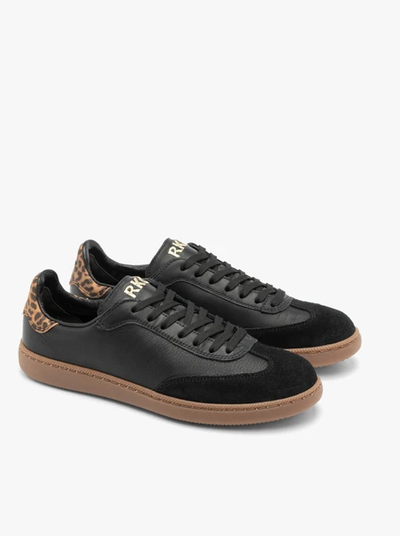 Schwarze Turnschuhe aus gebondetem Leder