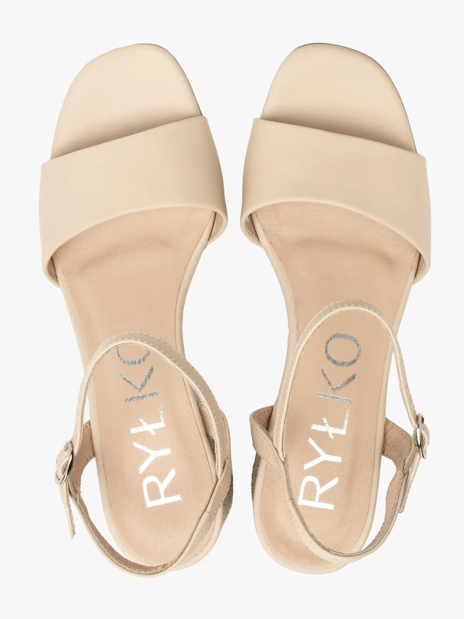 Beige sandals with decoratively covered heel
