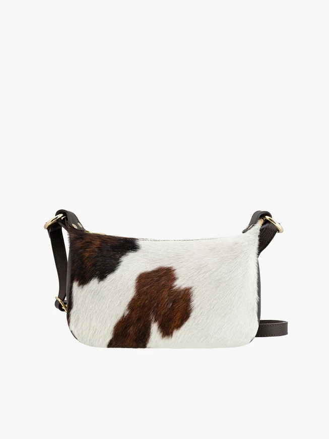 Medium-sized crossbody bag with cow print