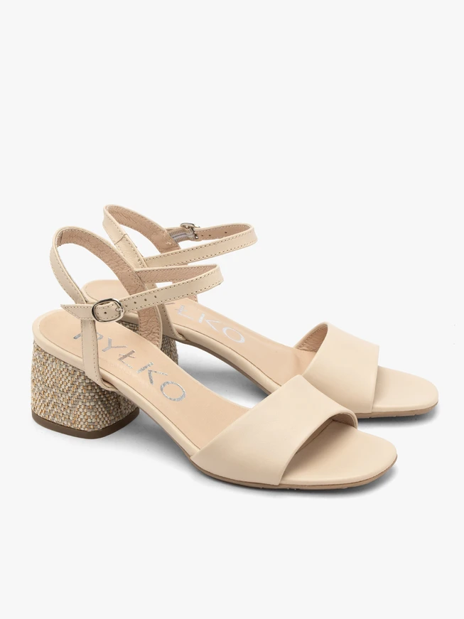 Beige sandals with decoratively covered heel