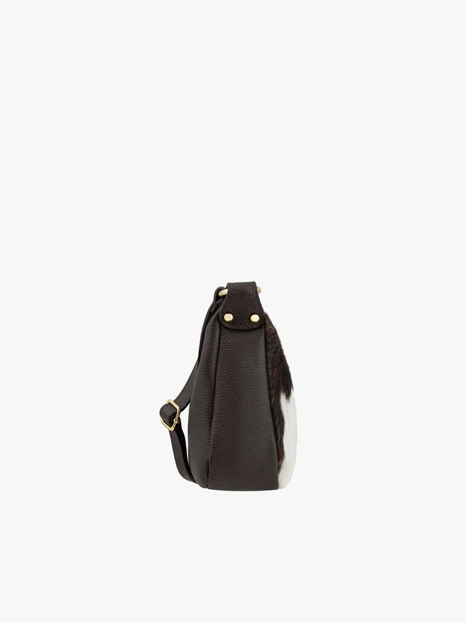 Medium-sized crossbody bag with cow print