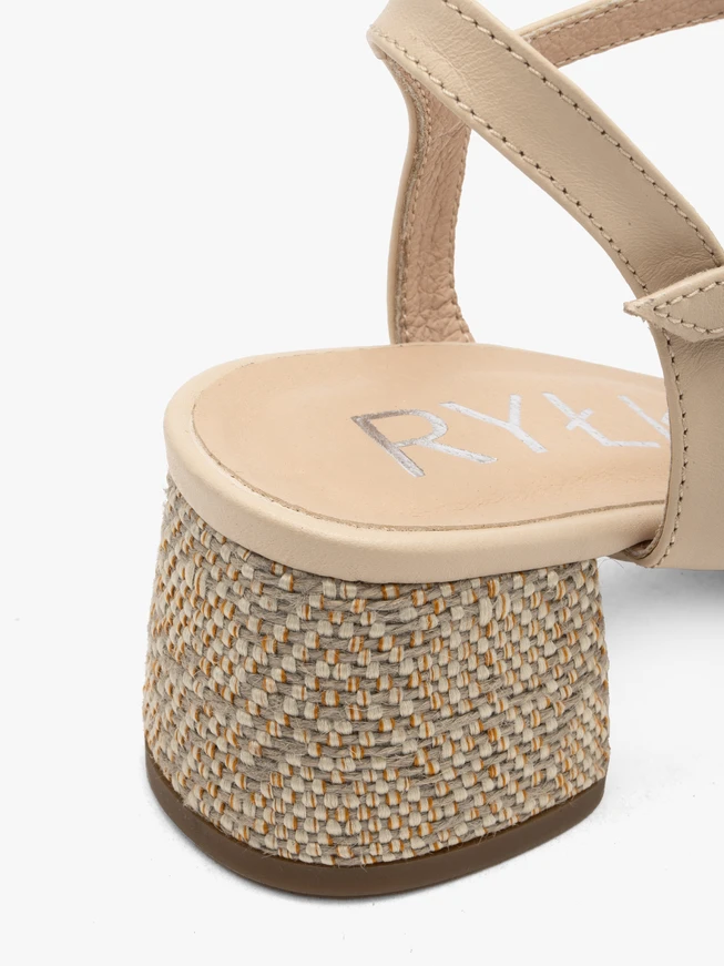Beige sandals with decoratively covered heel