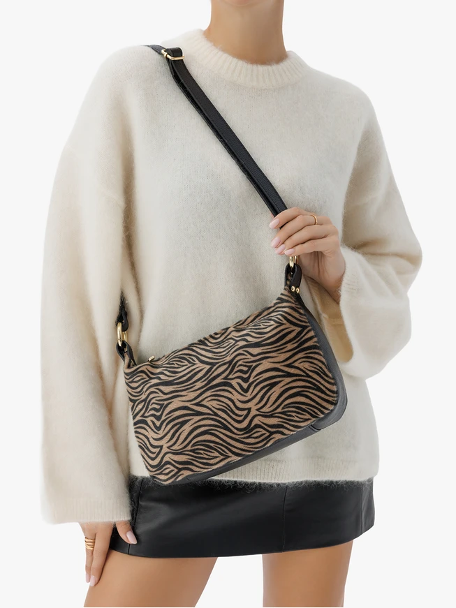 Handtasche mit schwarzem und beigem Tiermuster