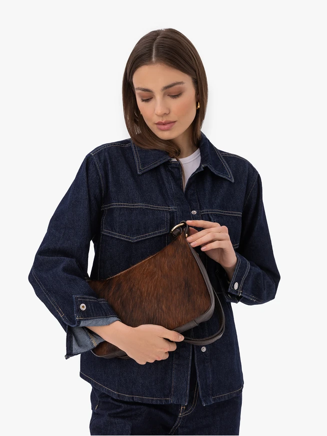 Medium-sized crossbody bag with cow print