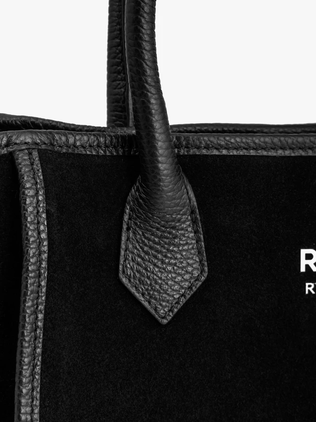 Schwarze große elegante Handtasche