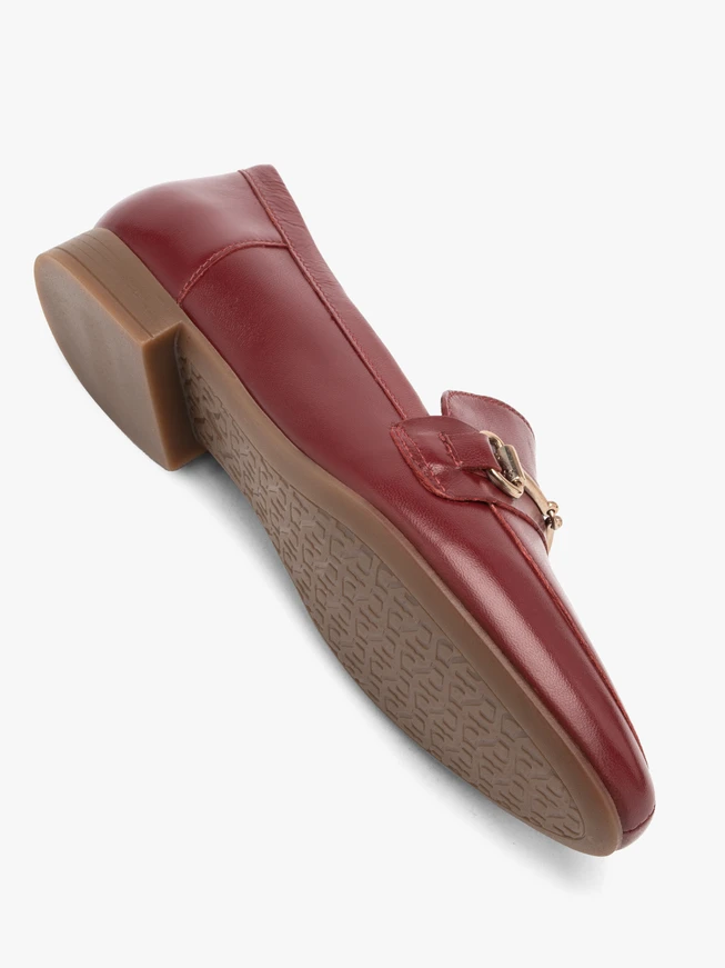 Maroon moccasins with platinum embellishment