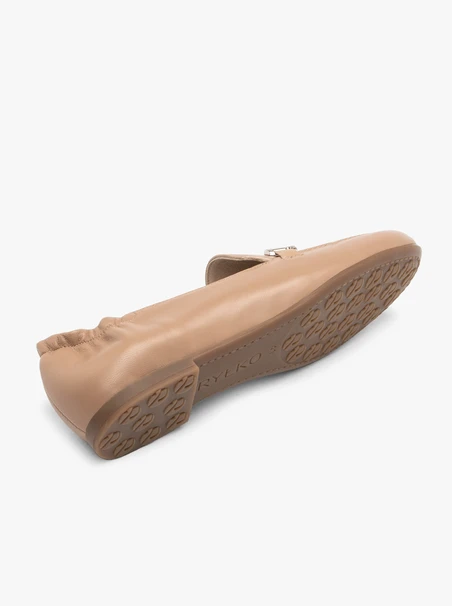 Beige women’s loafers with silver ornament
