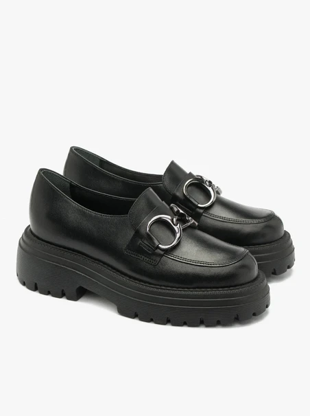Black loafers with ornament