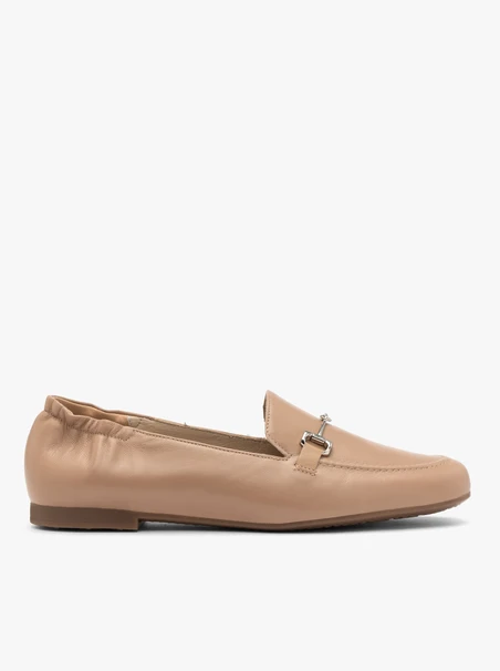 Beige women’s loafers with silver ornament