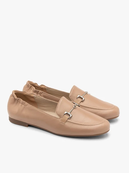 Beige women’s loafers with silver ornament