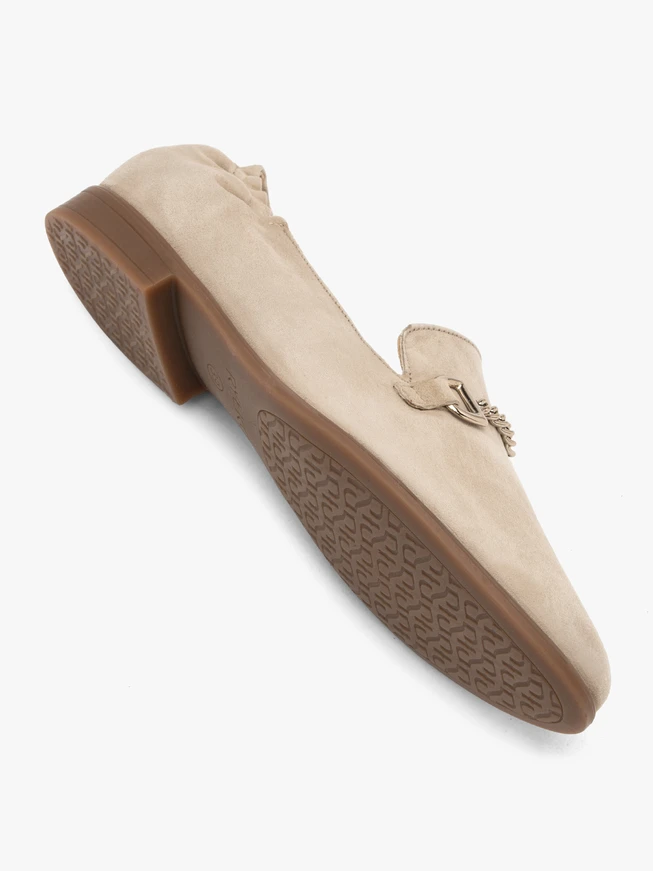 Beige women's moccasins on a flat sole