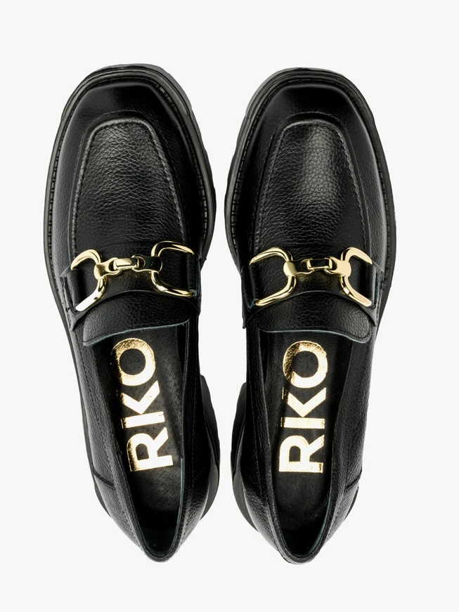 Black moccasins with gold embellishment