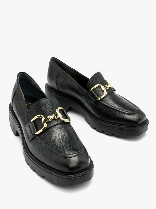 Black moccasins with gold embellishment