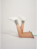 White sporty shoes with gold details