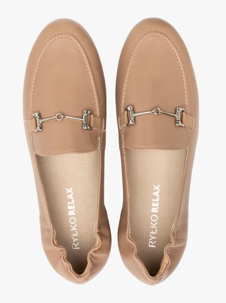 Beige women’s loafers with silver ornament