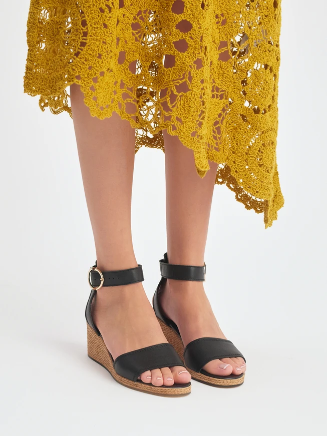 Black women's sandals with a string heel