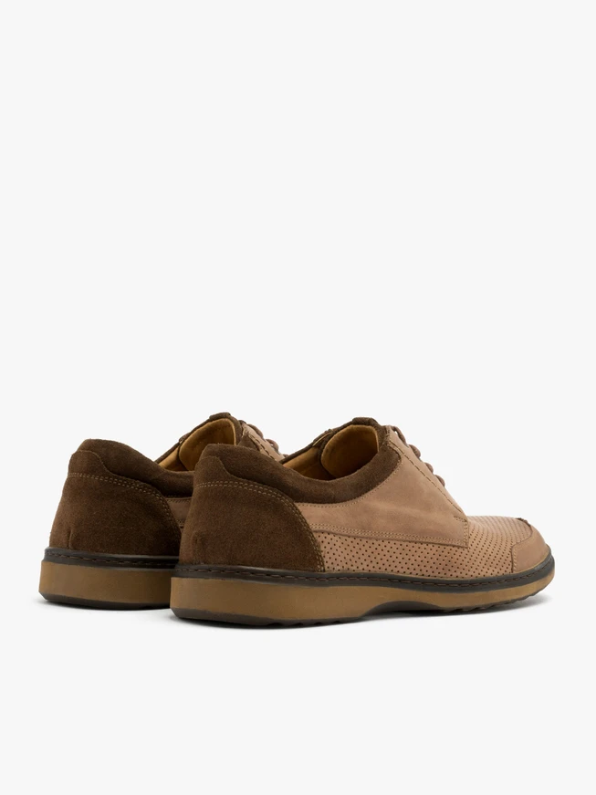 Brown shoes with decorative perforation