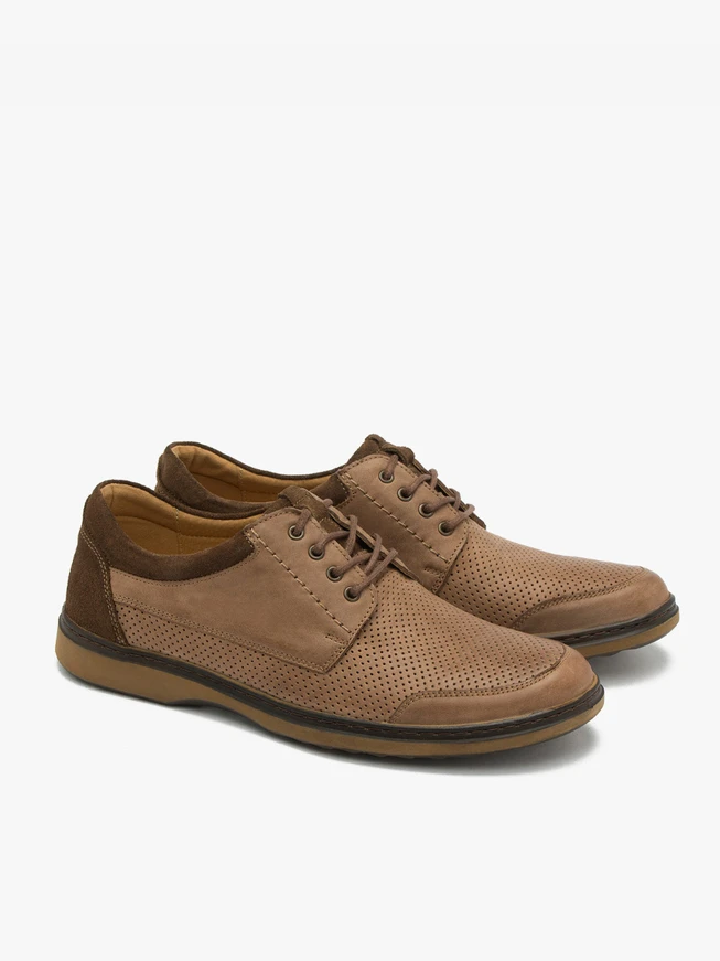 Brown shoes with decorative perforation