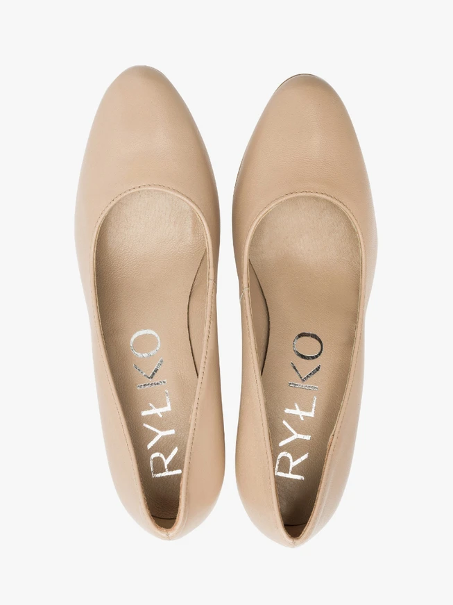 Beige pumps on a post