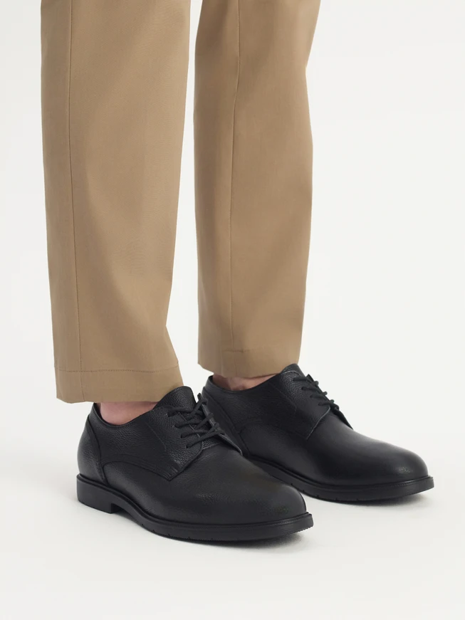 Black men's half shoe on a light bottom