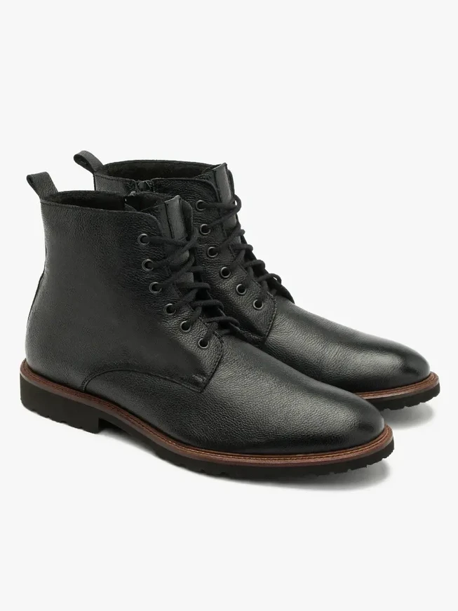 Black men’s boot with decorative welt