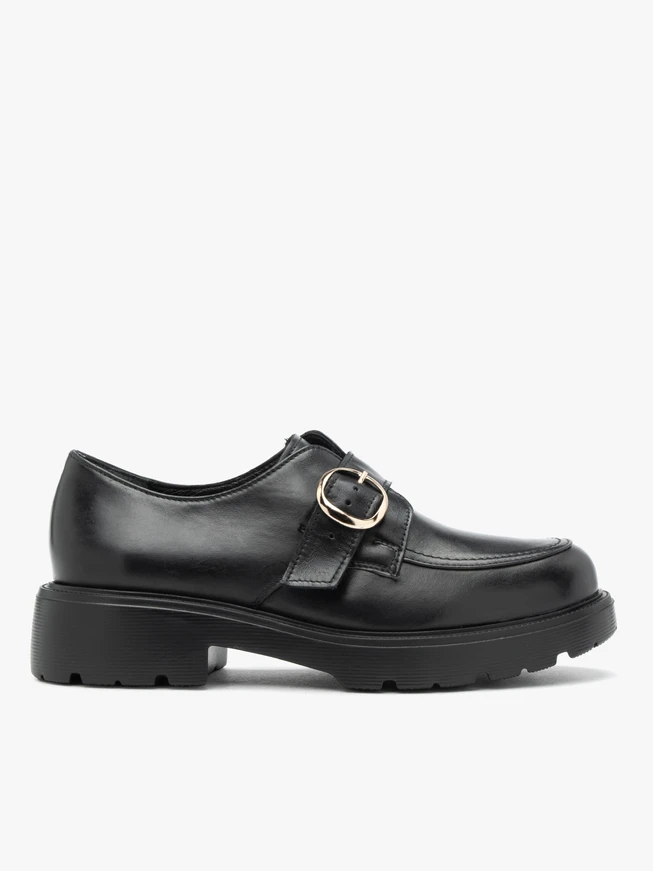 Black leather slip-ons with copper buckle