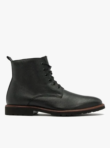 Black men’s boot with decorative welt